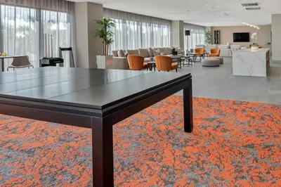 a table in the middle of a room with chairs at 805MM DOWNTOWN DORAL CONDO 2 BEDROOMS & 2 BATHROOMS in Miami