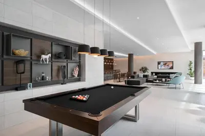 a living room with a pool table in it at 3900-502GJ DESIGN DISTRICT, CONDO 2 BEDROOMS & 2 BATHROOMS in Miami