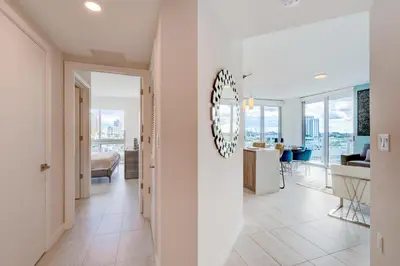 a hallway with a living room and a dining room at 3900-902CH DESIGN DISTRICT, CONDO 2 BEDROOMS & 2 BATHROOMS in Miami