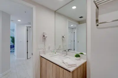a bathroom with a sink and a mirror at 3900-717AS DESIGN DISTRICT, CONDO 2 BEDROOMS & 2 BATHROOMS & BAY in Miami