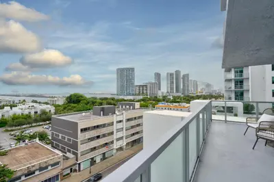 a balcony with a view of a city at 3900-717AS DESIGN DISTRICT, CONDO 2 BEDROOMS & 2 BATHROOMS & BAY in Miami