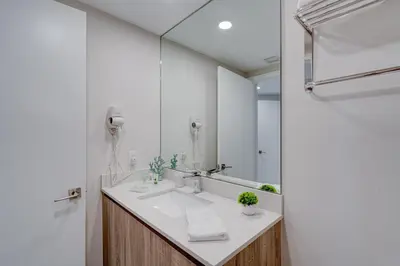 a bathroom with a sink and a mirror at 3900-717AS DESIGN DISTRICT, CONDO 2 BEDROOMS & 2 BATHROOMS & BAY in Miami
