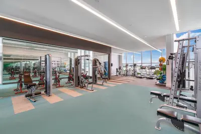 a gym with treadmills and machines in a building at 3900-602LG DESIGN DISTRICT, CONDO 2 BEDROOMS & 2 BATHROOMS in Miami