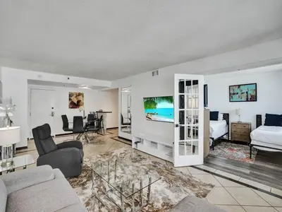 a large living room with a bed and a bedroom at High floor Oceanview condo 1506 in Miami Beach