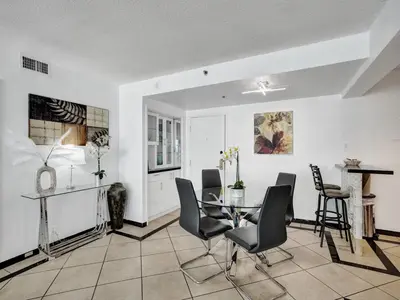 a dining room with a table and chairs at High floor Oceanview condo 1506 in Miami Beach