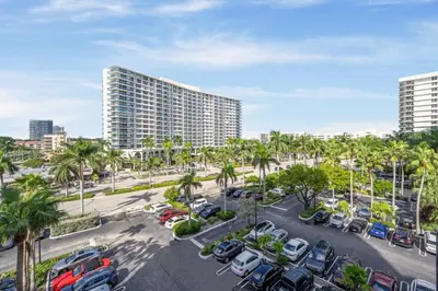 a view of a parking lot with palm trees and buildings at Tides in Hollywood Beach By My Miami Vacation in Hollywood