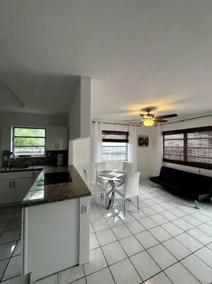 a kitchen with a table and a dining room at Beautiful Home in Florida in Hollywood