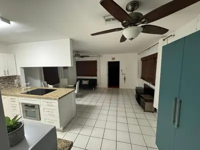an empty kitchen with a ceiling fan in a room at Beautiful Home in Florida in Hollywood