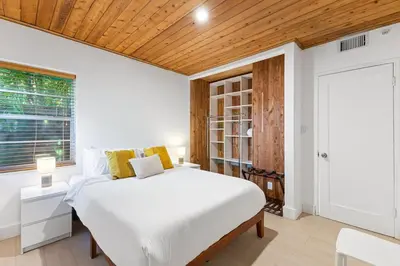 a bedroom with a white bed and a wooden ceiling at Welcoming Airbnb Walkig distance to Las Olas Blvd in Fort Lauderdale