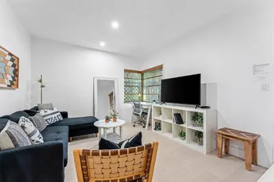 a living room with a couch and a tv at Beautiful Apt in Victoria Park (Las Olas Blvd) in Fort Lauderdale