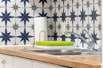 a kitchen counter with a sink and blue stars at Bright and Stylish Apt in Las Olas Blvd Victoria Park in Fort Lauderdale