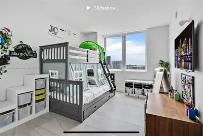 a room with a bunk bed and a desk at Apartment 3B/3B Bay View in Hallandale Beach