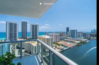a view of the ocean from a balcony of a city at Apartment 3B/3B Bay View in Hallandale Beach