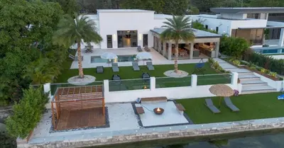 an aerial view of a house with a yard at Waterfront Mansion The GlamHomes in North Miami Beach