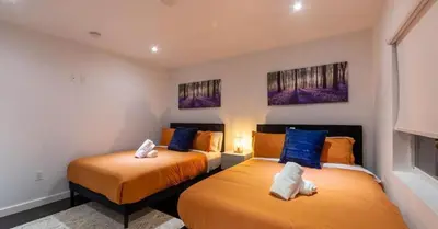 two beds in a small room with two bedsvisor at New Oasis Waterfront & Sand Terrace THG in Miami