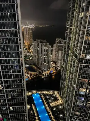 a view of a city at night with tall buildings at Water & Pool Views, One bedroom W hotel building in Miami