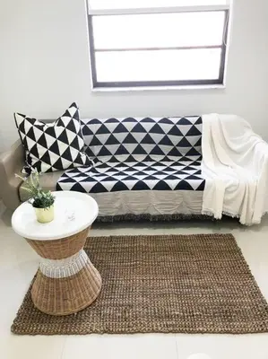 a living room with a couch and a rug at MODERN AND ECLECTIC APARMENT A STEPS THE BEACH in Miami Beach