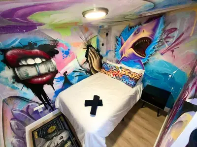 a bedroom with a painting of a bed in a room at Cozy & Colorful Miami Art Canvas w/HotTub & Murals in Miami