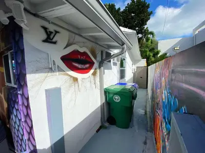 a wall with a mural of alip on it at Cozy & Colorful Miami Art Canvas w/HotTub & Murals in Miami