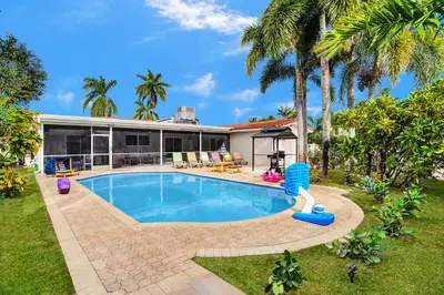 an image of a house with a swimming pool at Sensational 5BR Villa Heated Pool near Hard Rock in Hollywood