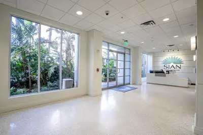 an office with a large room with large windows at SIAN private Apartments in Hollywood