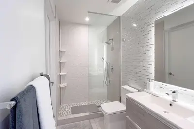 a white bathroom with a toilet and a sink at New 1/1 Apartment in Smart Brickell with Parking in Miami