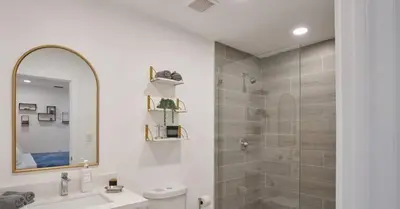 a bathroom with a shower and a sink and a mirror at Luxurious Villa with Elegant Interior and Mini Golf TGH in Hollywood