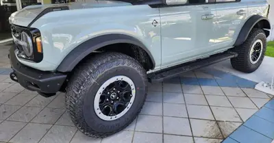 a blue jeep truck parked on a tile floor at Luxurious Villa with Elegant Interior and Mini Golf TGH in Hollywood