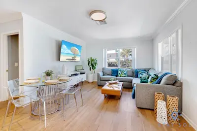 a living room with a couch and a table at Beach Paradise, Family - Friendly, Free Parking in Hollywood