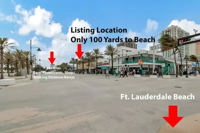 an empty street with two arrows pointing to an intersection at Studio Right off Las Olas - Steps to FTL Beach 1C in Fort Lauderdale