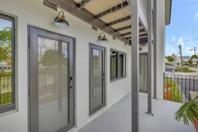 a row of sliding glass doors on a building at Condo Right off Las Olas - Steps to FTL Beach 2A in Fort Lauderdale