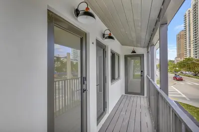 a balcony with a door and a view of a street at Studio Right off Las Olas - Steps to FTL Beach 2C in Fort Lauderdale