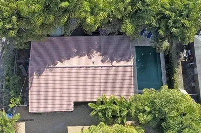 an overhead view of a pink building with trees at Heated pool, parking, 5 min walk to food and fun! in Fort Lauderdale