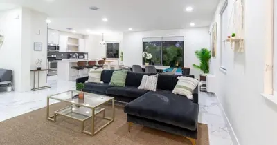 a living room with a couch and a table at Tropical Villa wJacuzzi Big Terrace & Billiards in Miami