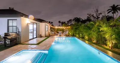 a swimming pool in the backyard of a house at Tropical Villa wJacuzzi Big Terrace & Billiards in Miami