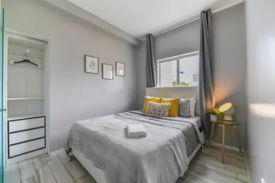 a bedroom with a bed and a window at Wynwood Amazing Condo Sleeps 5 Close to Beach in Miami