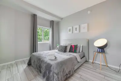 a bedroom with a bed and a window at Wynwood Amazing Condo Sleeps 5 Close to Beach in Miami