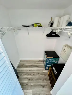 a room with a shelf with books and other items at Balcony Ocean View ! Pool - WiFi - Gym - Parking in Miami