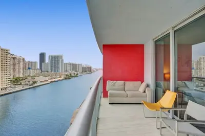 a living room with a view of a river at Awesome Ocean View Modern Condo Pool Shuttle in Hallandale Beach