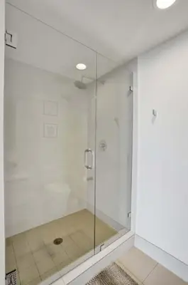 a shower with a glass door in a bathroom at Lower Penthouse 3BD 3BA Beach Gym and Pool in Hallandale Beach