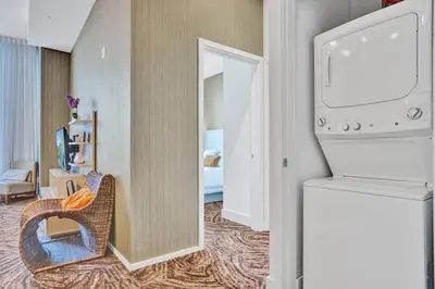 a living room with a refrigerator and a room at Oceanfront Condo Direct Ocean View Beach Access in Hollywood