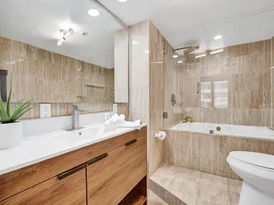 a bathroom with a tub and a toilet and a sink at Amazing Ocean View Condo Beach Service 607 in Miami Beach