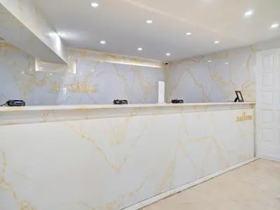 a bar in a room with a marble wall at Ocean View Beach Retreat Beach Service 606 in Miami Beach