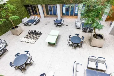 an overhead view of a patio with tables and chairs at Worth Traveling Hot tub & Unique Rooftop pool in Hollywood