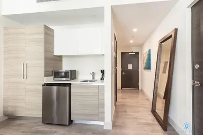 a kitchen with a sink and a microwave at The Most Liked Homes Hot tub & Unique Rooftop in Hollywood