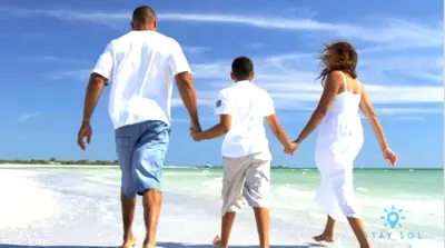 a man and a woman walking on the beach at Rooftop Pool & Hot Tub Hollywood Beach Gym in Hollywood