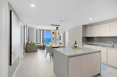 a kitchen and living room with a view of the ocean at Breathtaking Front Ocean View: Amazing Pools in Hollywood