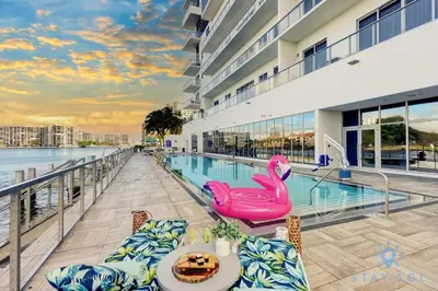 a swimming pool with a pink swan on a balcony at Breathtaking Front Ocean View: Amazing Pools in Hollywood