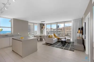 a kitchen and living room with a view of the city at Wrap Around Balcony-Awesome View-Amazing Pools in Hollywood