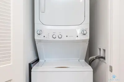 a white washer and dryer in a kitchen at Wrap Around Balcony-Awesome View-Amazing Pools in Hollywood